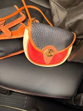 Dooney & Bourke Black, Red, Cream Pebbled Leather Crossbody